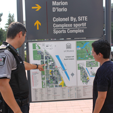 Two people looking at a campus map