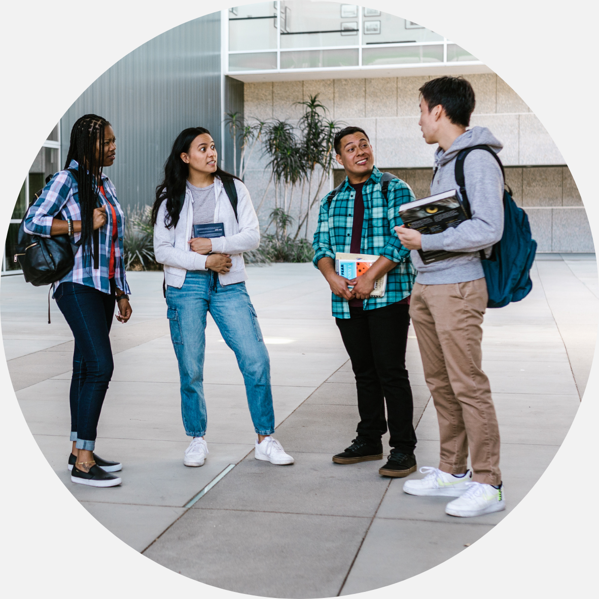 Four students on campus talking