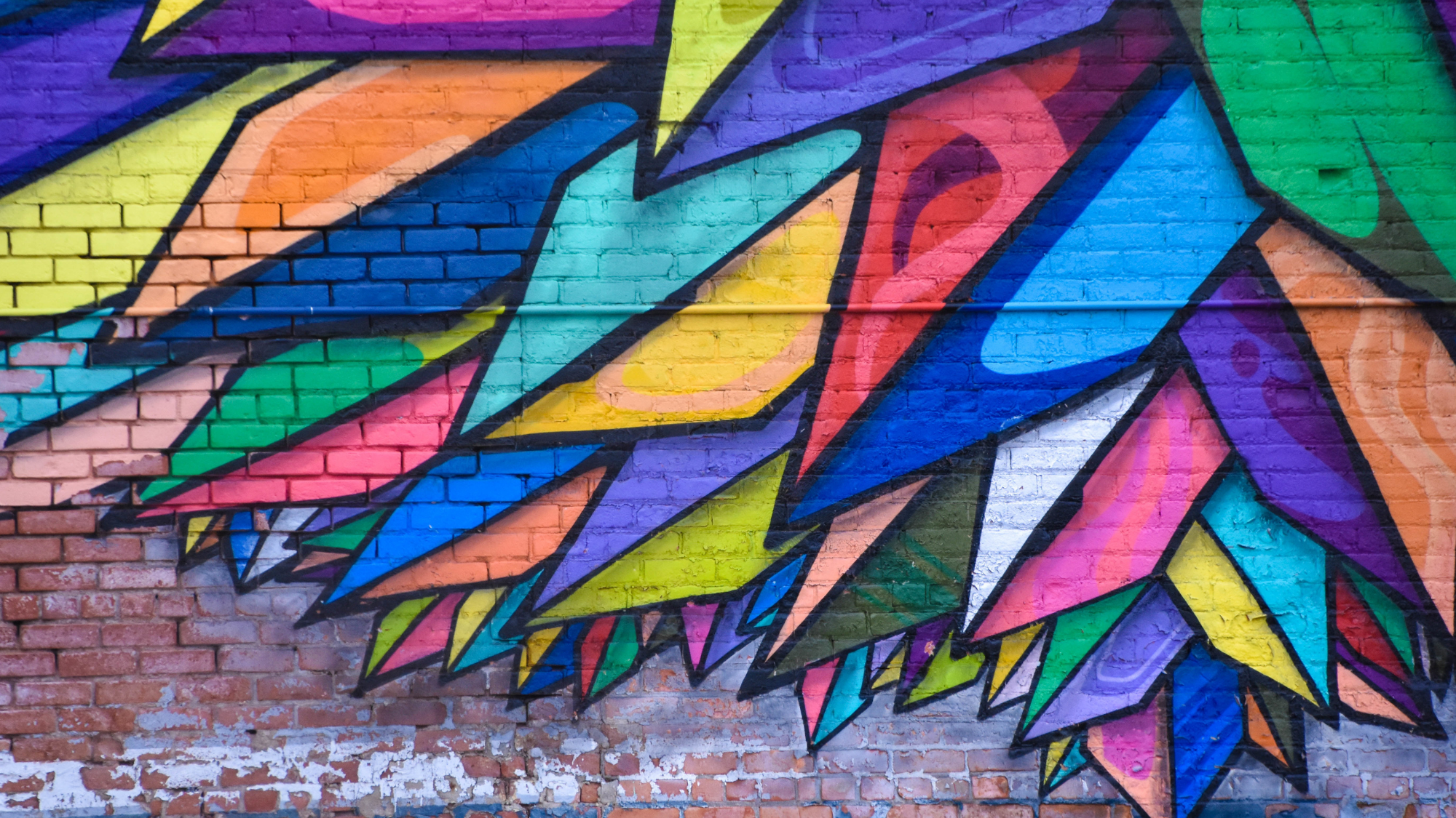colourful painting on a brick wall