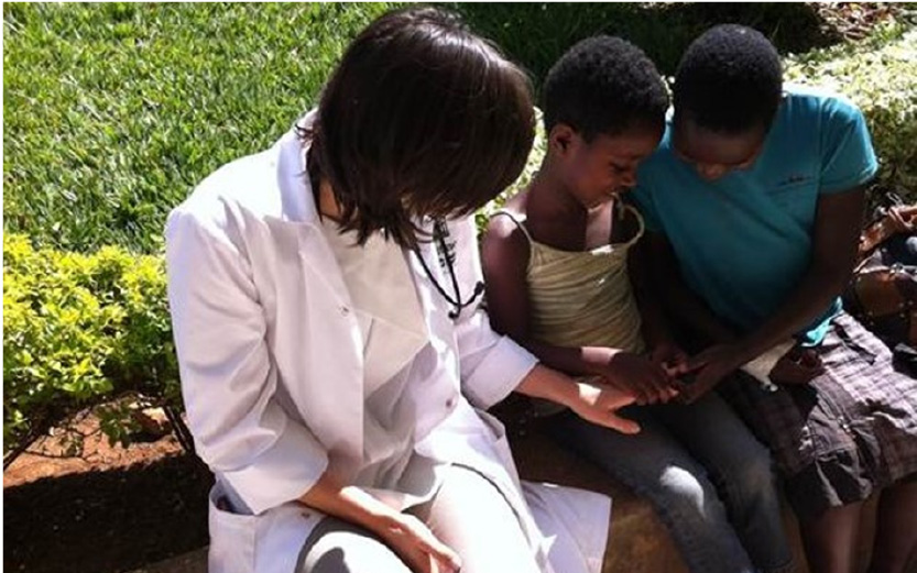 Medical student playing with children