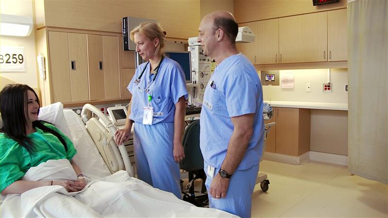 Doctors visiting a patient