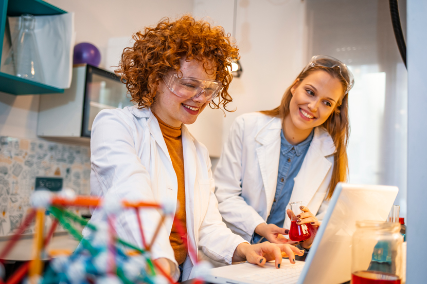 Two women scientist doing research