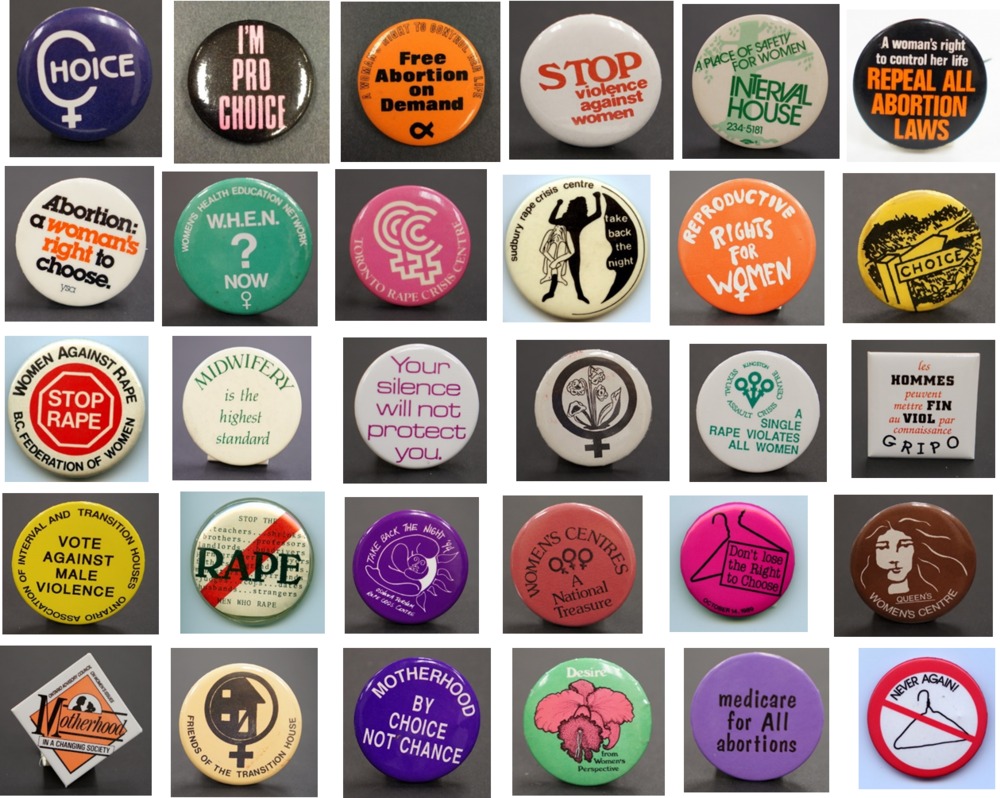 Various buttons in regards to women's movement.