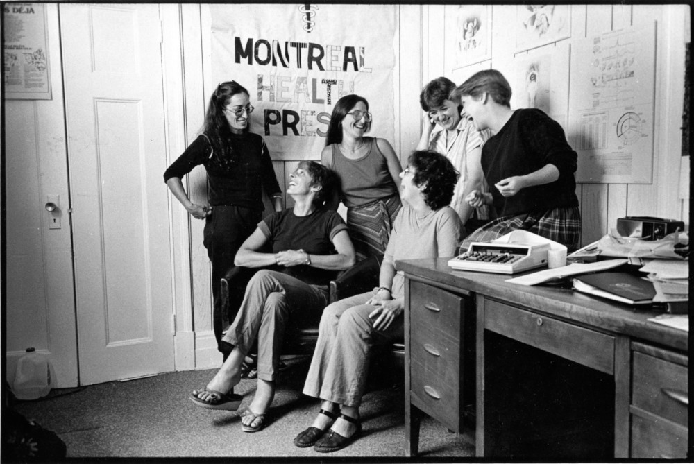 Women sitting inside the Montreal health press.