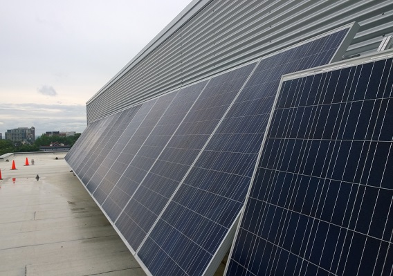 Two large solar cells on the roof of a building 