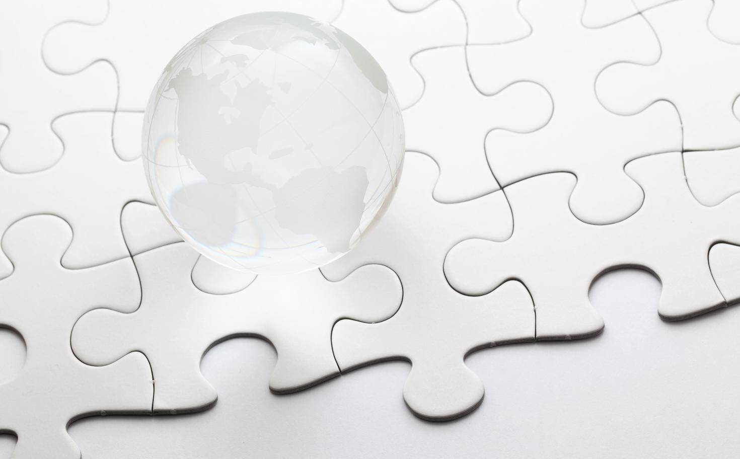 Glass globe with puzzle background