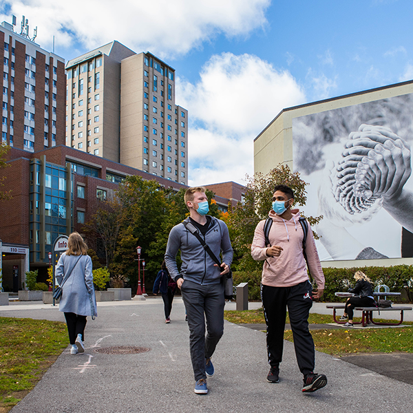 students walking with face mask